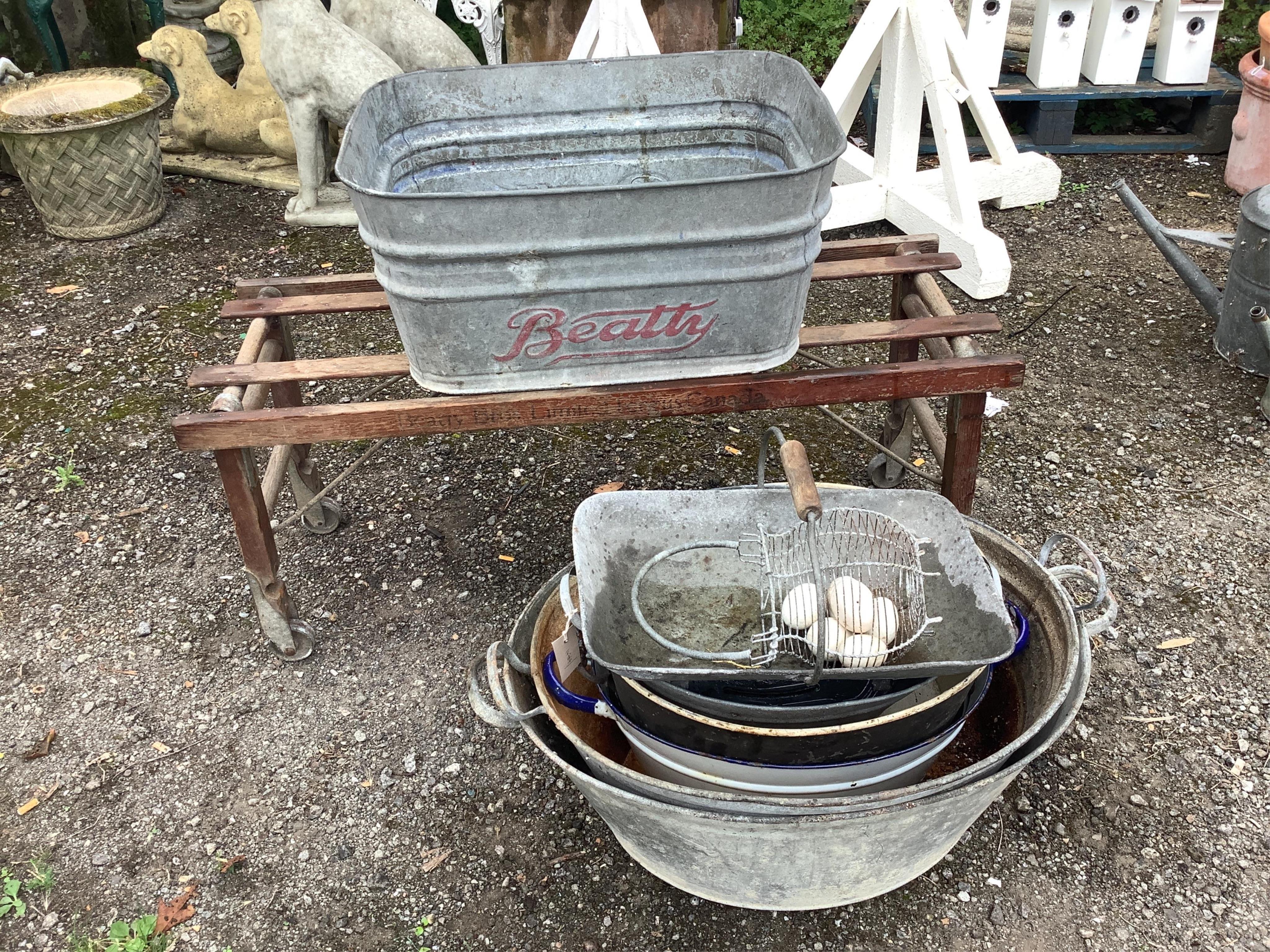 A vintage Beatty Bros. Ltd. folding wheeled stand and galvanised container, six other galvanised and enamel containers and sundries. Condition - fair